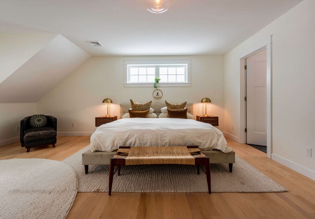 5 John West Road Exeter, NH 03833 - Photo 14 of 33 a bedroom with a bed and a couch