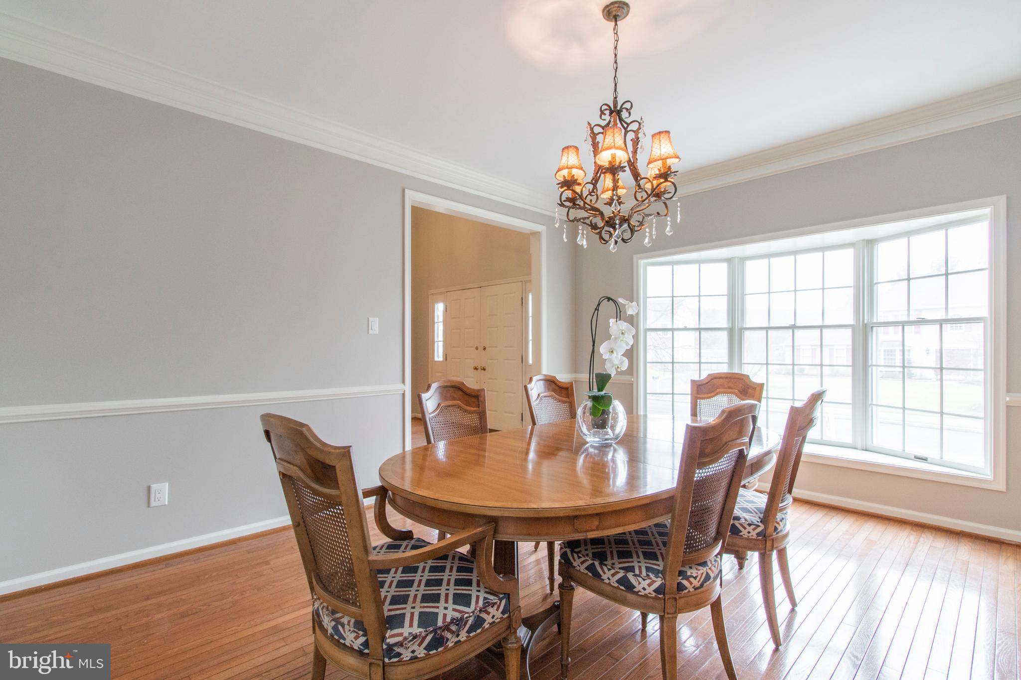 825 Redgate Road Dresher, PA 19025 - Photo 7 of 34 Light filled with crown molding & chair rail.