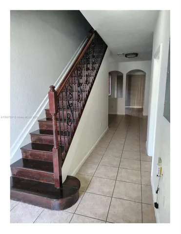a view of a living room with a wooden floor