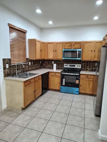 a bathroom with a glass door shower