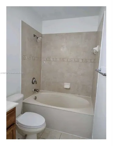 a bathroom with a sink a toilet and a bathtub