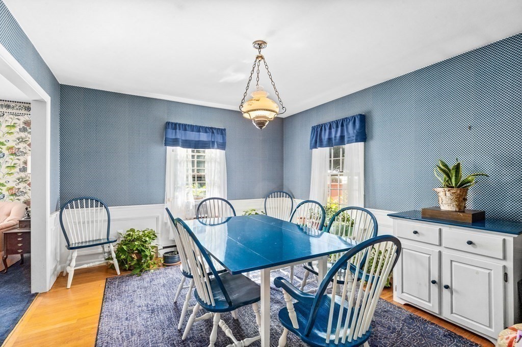 387 County Road Marion, MA 02738 - Photo 9 of 25 a dining room with furniture a chandelier and wooden floor