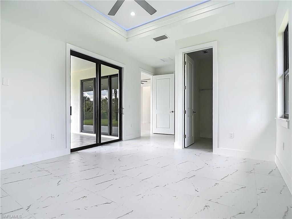 2707 36th Avenue Southeast Naples, FL 34117 - Photo 30 of 50 Spare room with light marble finish flooring, ceiling fan, and recessed lighting