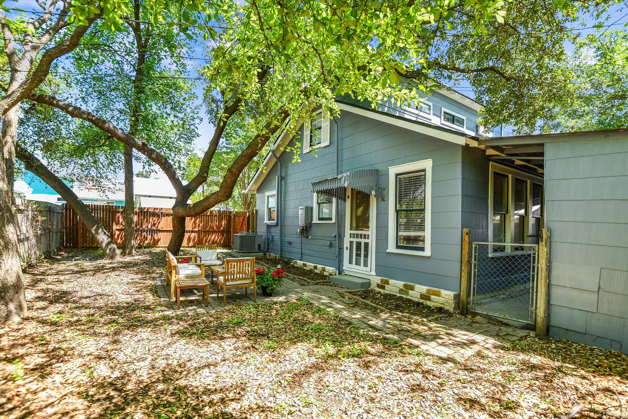 1105 West 43rd Street Austin, TX 78756 - Photo 21 of 22 a backyard of a house with table and chairs