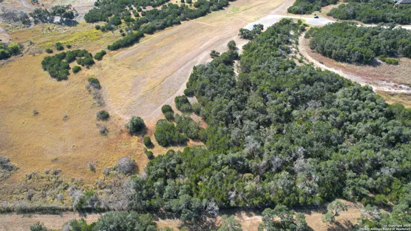 a view of a lake with a yard