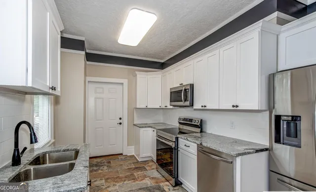 a bathroom with a sink toilet a mirror and shower