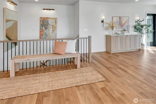 a view of a bedroom and wooden floor
