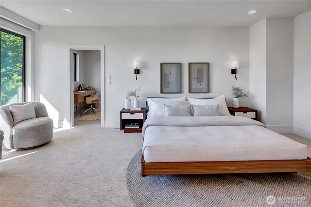 a bedroom with bed and furniture with window