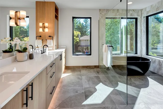 a room with granite countertop a couch a table and chairs