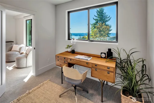 a room with patio furniture and a potted plant