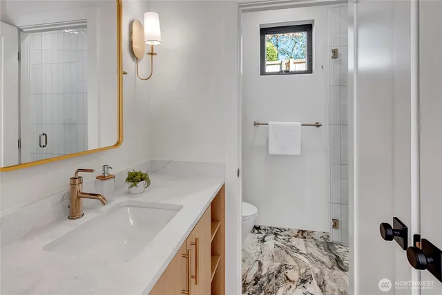 a bathroom with a sink and a mirror