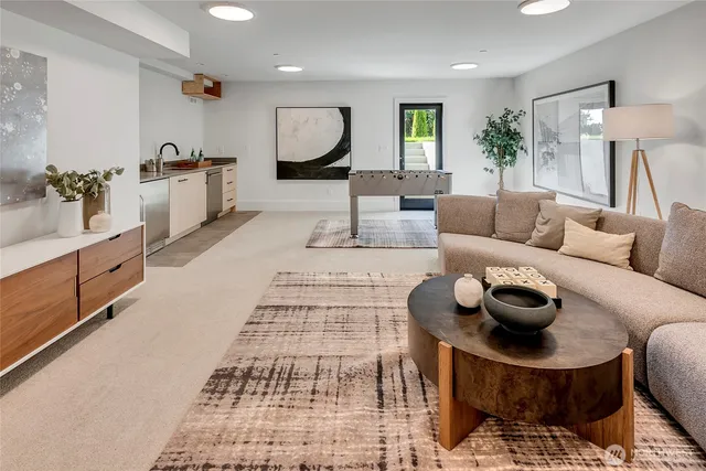 a living room with furniture and a rug