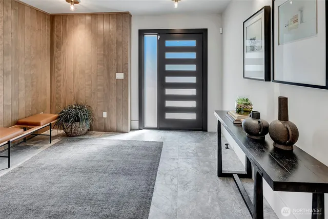 a living room with furniture and stairs