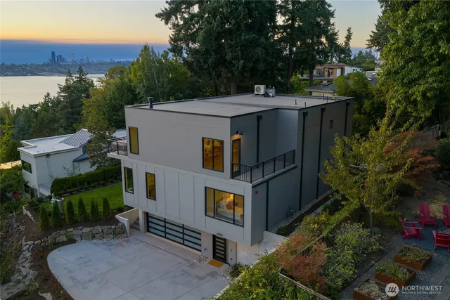 aerial view of a house with a yard and potted plants