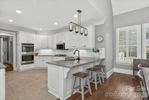 a large kitchen with lots of counter space and window
