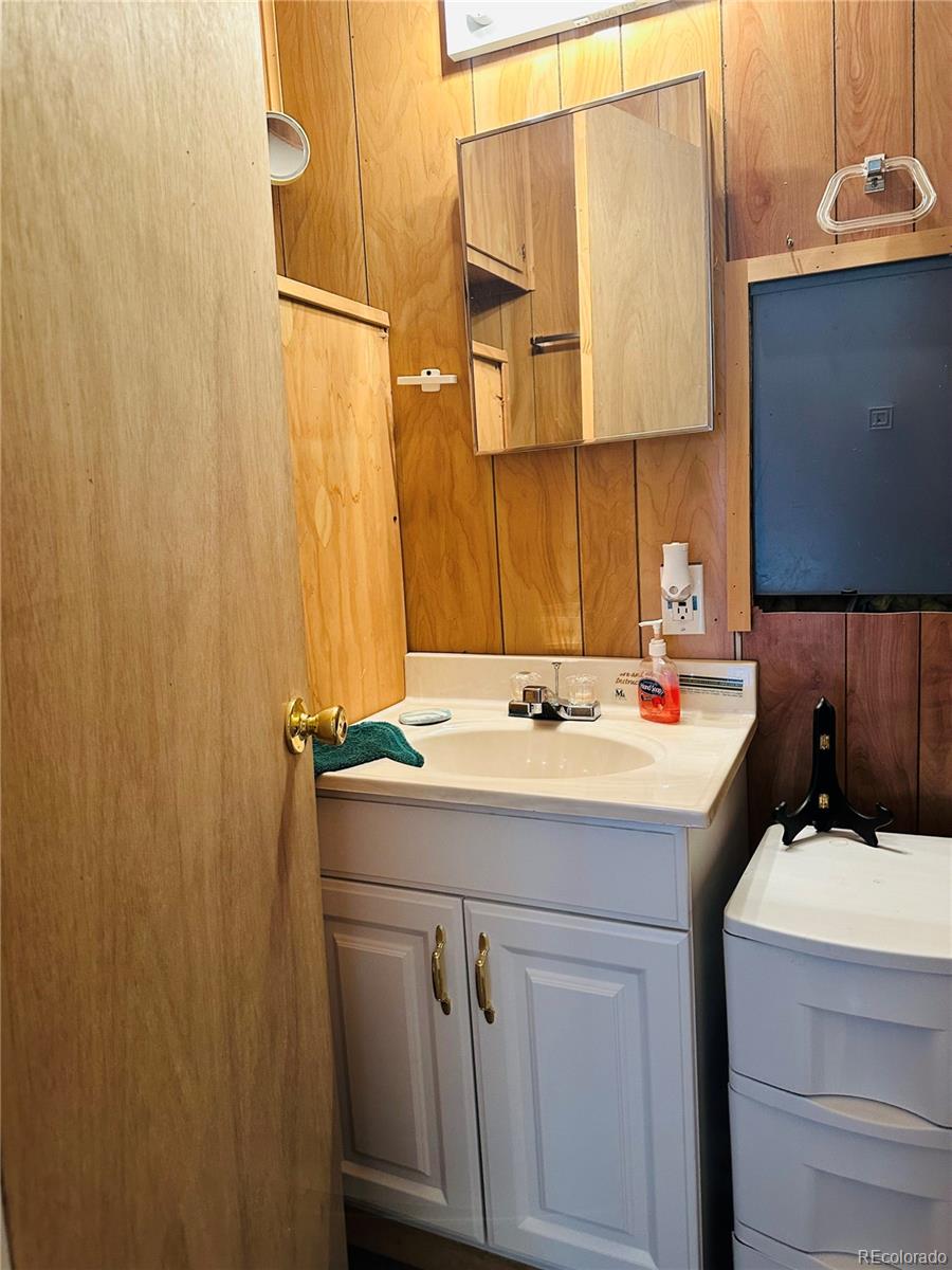 0 County Road La Jara, CO 81140 - Photo 11 of 26 a bathroom with a sink and a mirror