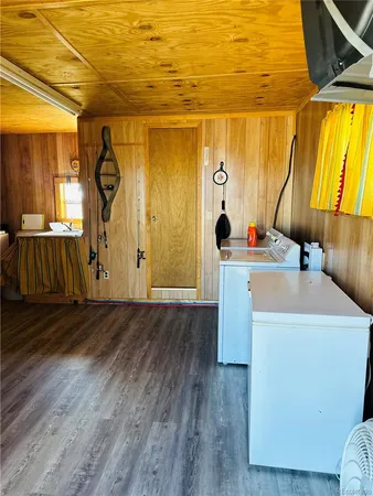 a room with wooden floor and window