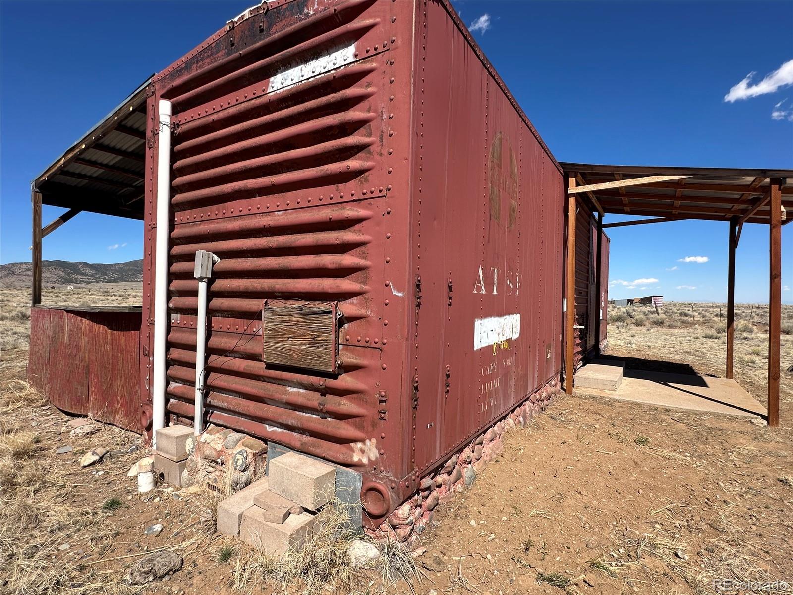 0 County Road La Jara, CO 81140 - Photo 20 of 26 a view of a house with a snow in the yard