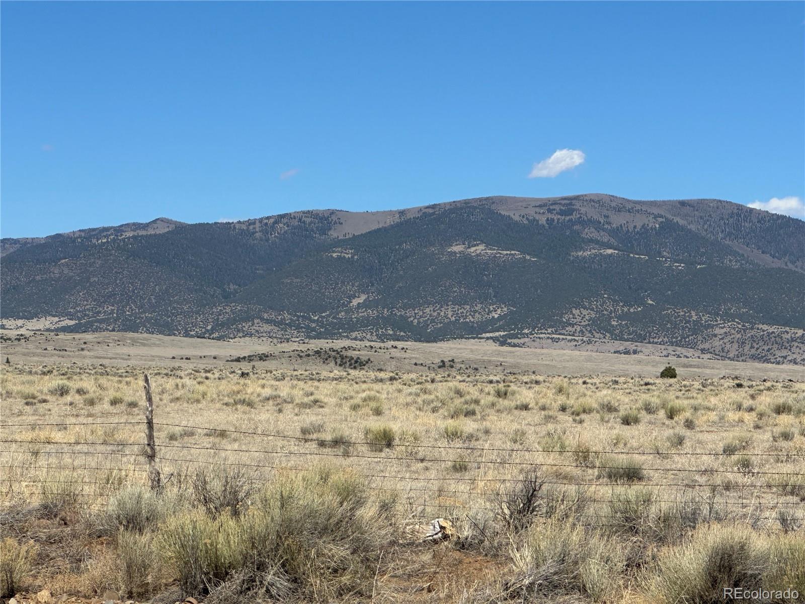 0 County Road La Jara, CO 81140 - Photo 23 of 26 a view of a dry yard with mountain