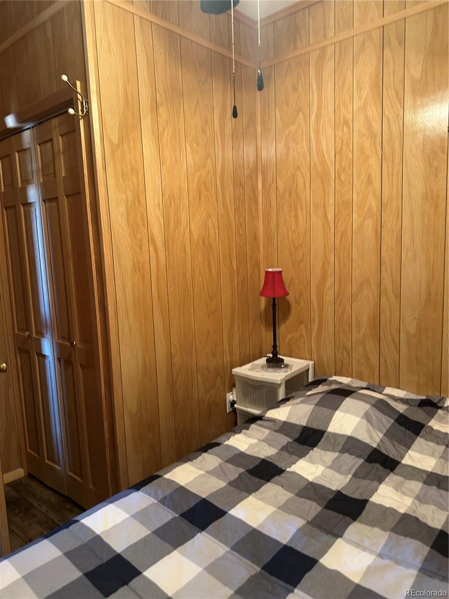 0 County Road La Jara, CO 81140 - Photo 7 of 26 a bedroom with a bed and a mirror