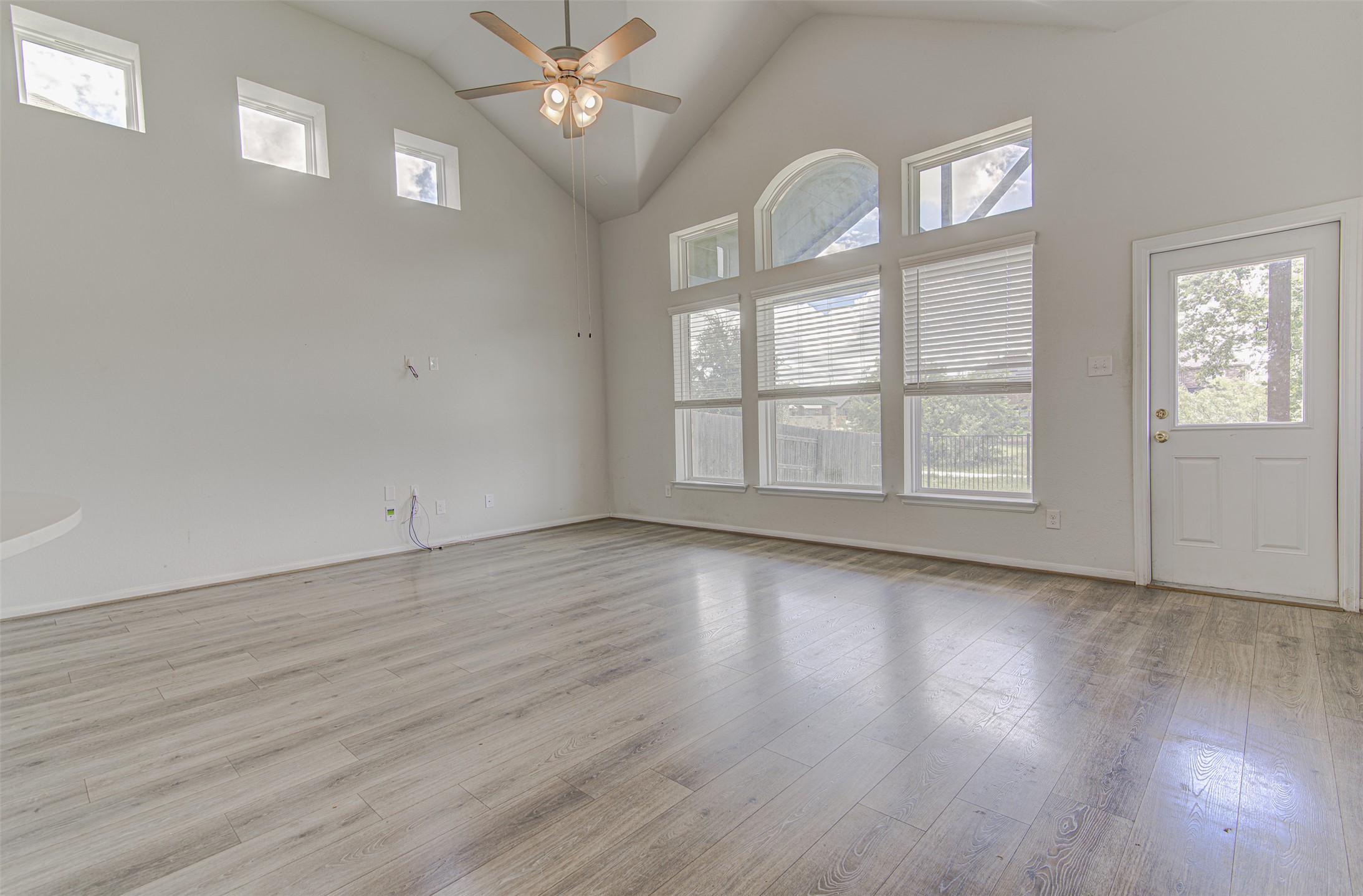 774 Cherrystone Loop Buda, TX 78610 - Photo 13 of 38 A grand living space with high vaulted ceilings and abundant natural light.