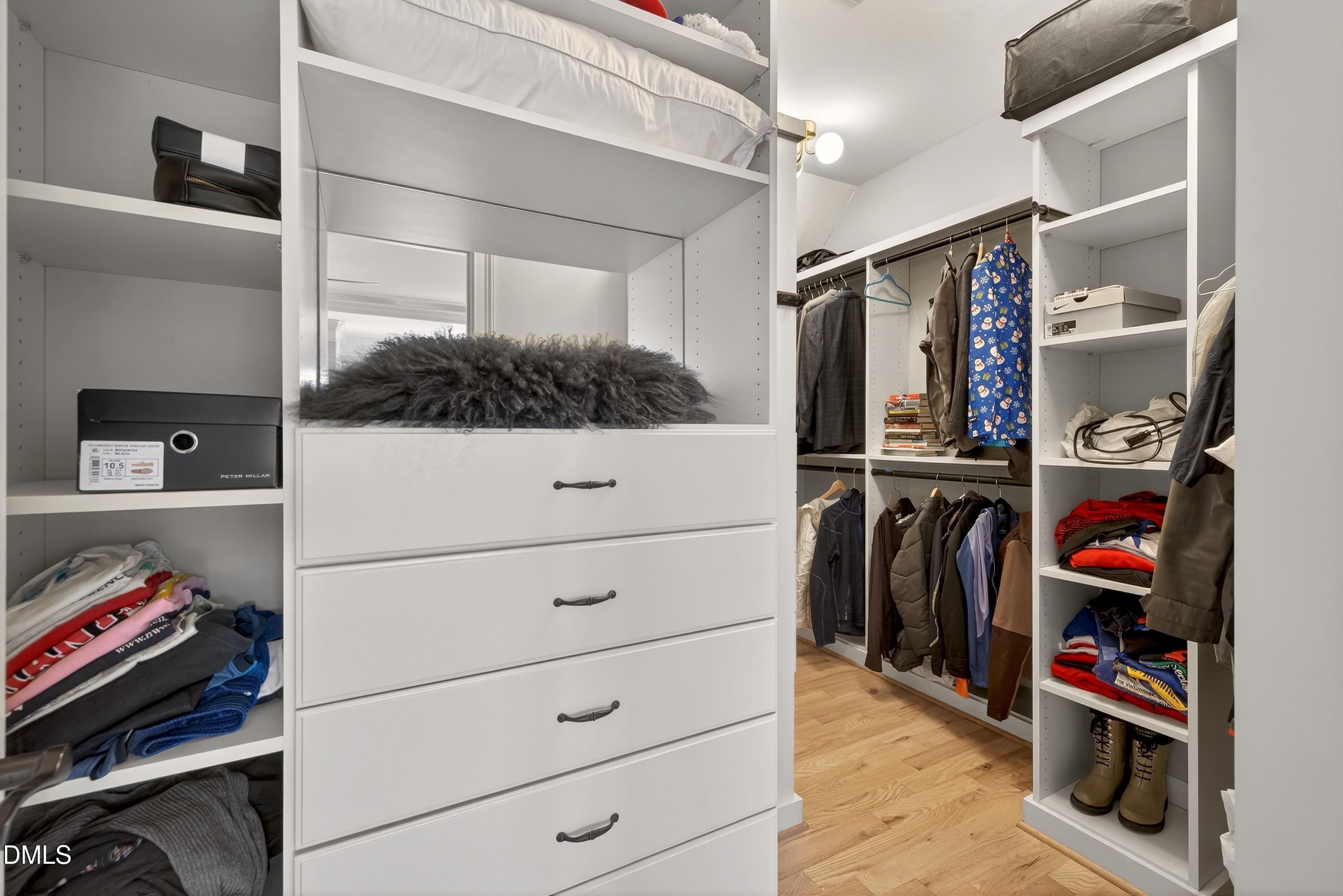 6701 Foxfire Place Raleigh, NC 27615 - Photo 39 of 67 a view of walk in closet with clothes and shoes