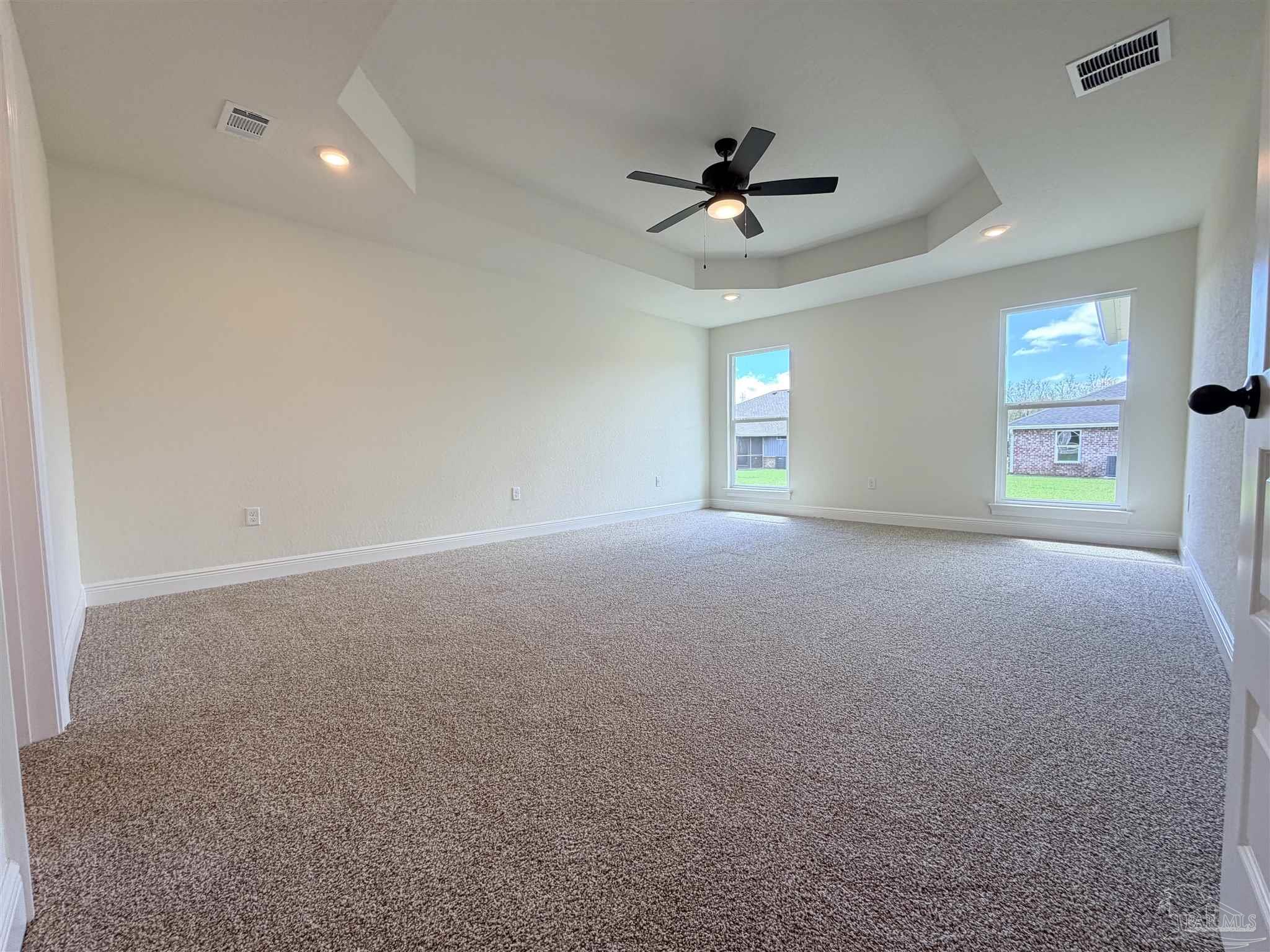 5263 Wahoo Road Milton, FL 32583 - Photo 12 of 25 a view of a livingroom with a ceiling fan and window