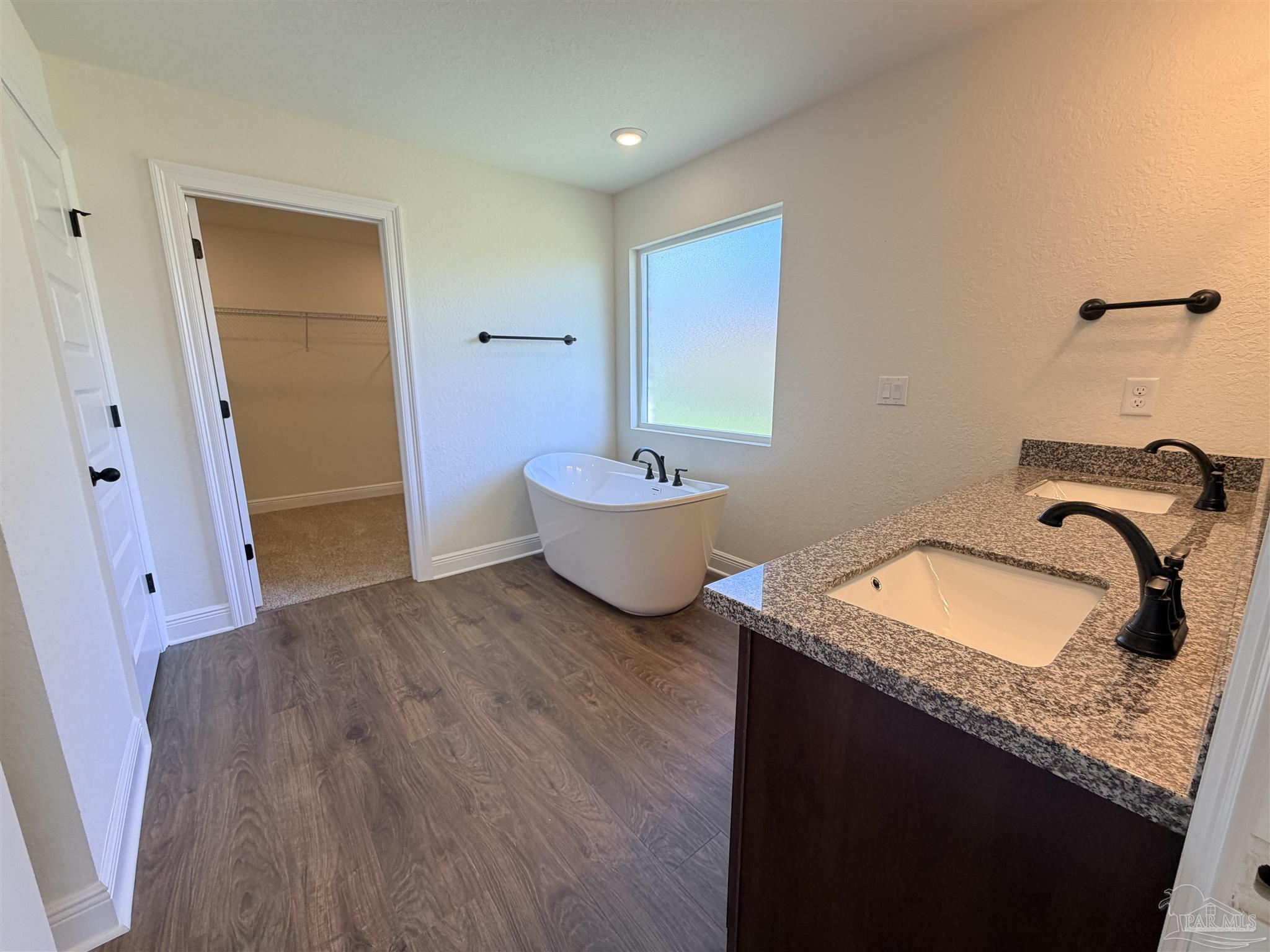 5263 Wahoo Road Milton, FL 32583 - Photo 13 of 25 a bedroom with a granite countertop sink and a mirror