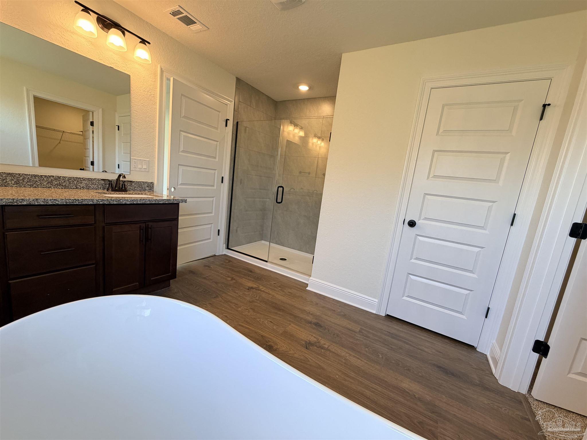 5263 Wahoo Road Milton, FL 32583 - Photo 14 of 25 a bathroom with a sink and a mirror