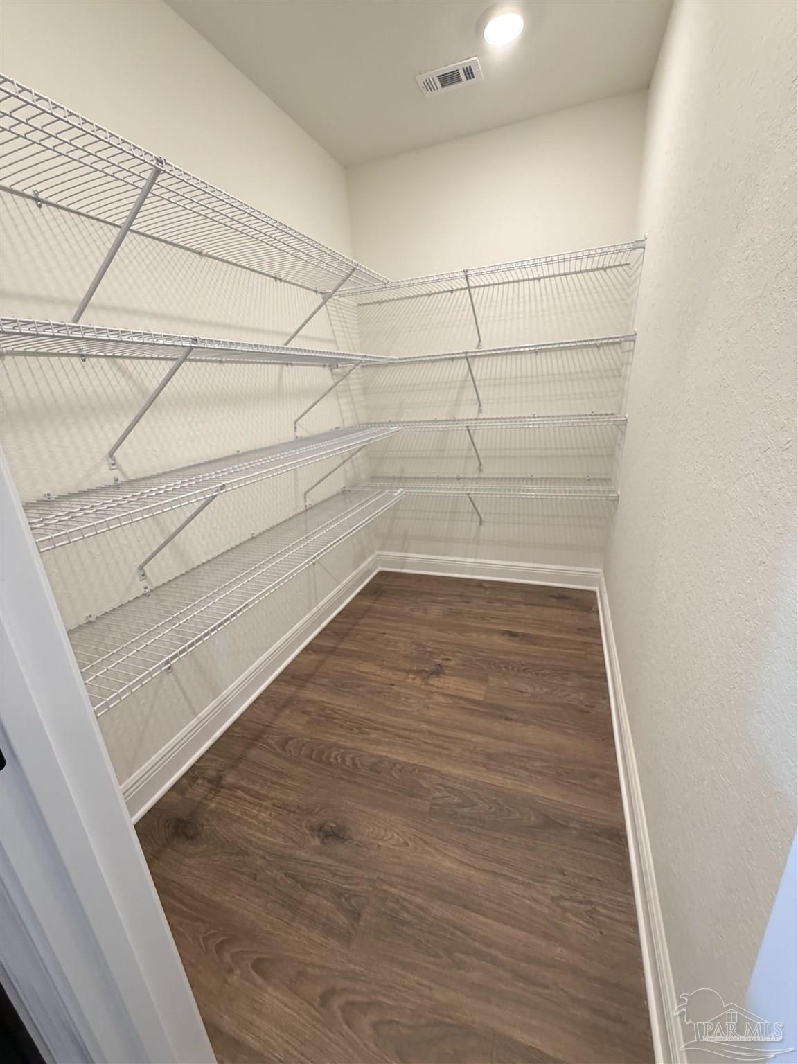5263 Wahoo Road Milton, FL 32583 - Photo 20 of 25 a view of a room with racks on the wall