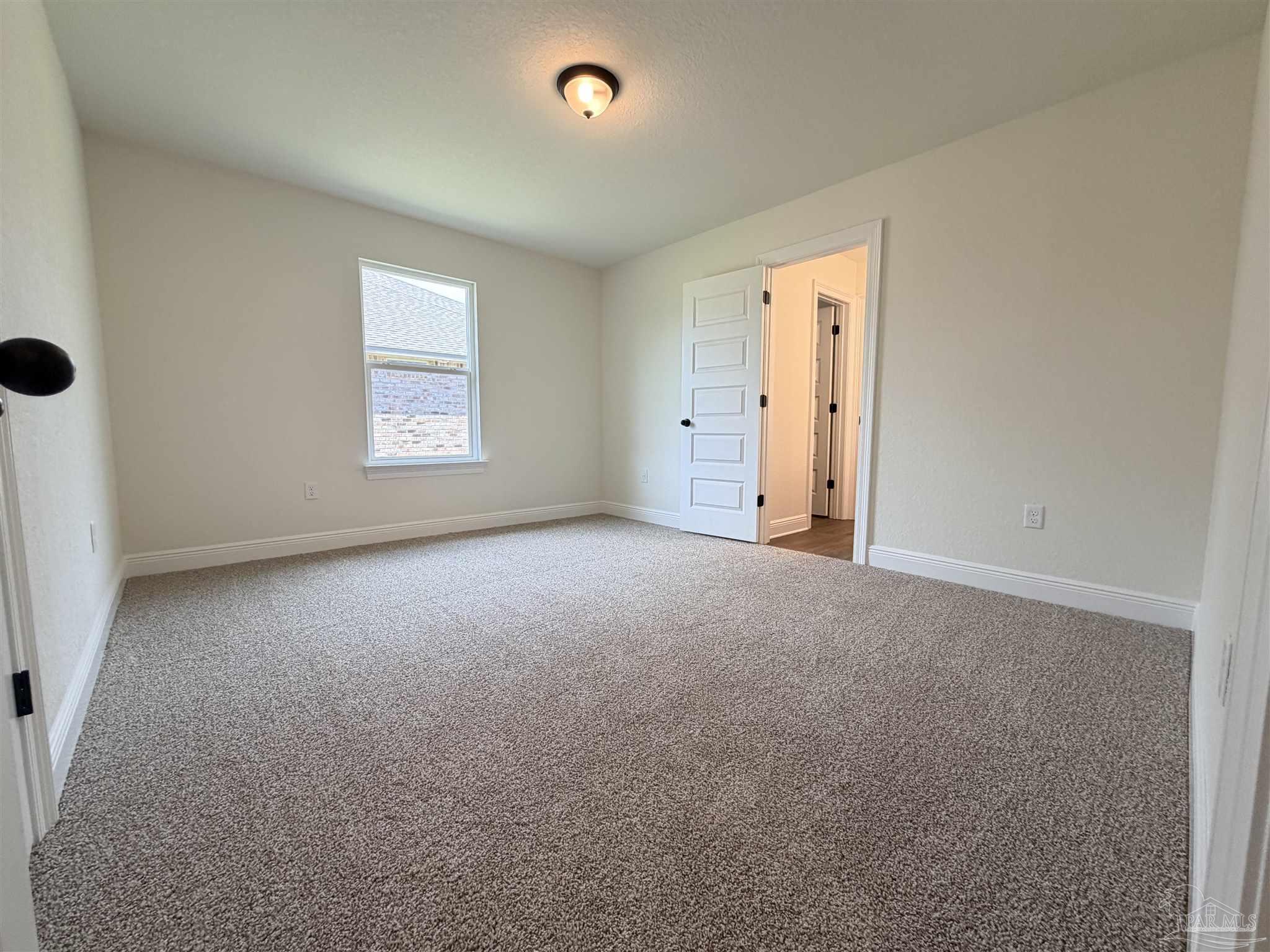5263 Wahoo Road Milton, FL 32583 - Photo 21 of 25 an empty room with windows