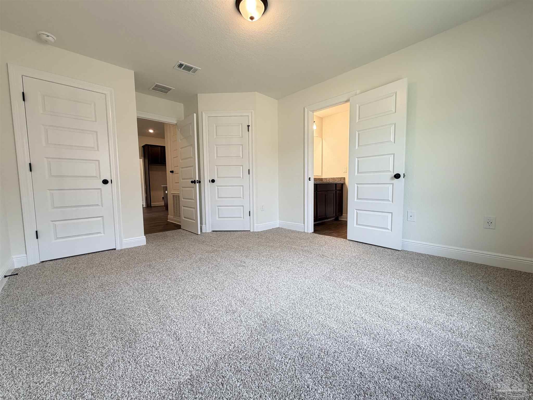 5263 Wahoo Road Milton, FL 32583 - Photo 23 of 25 an empty room with closet and windows