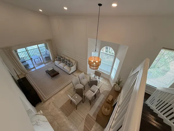a view of living room with furniture and a wooden floor