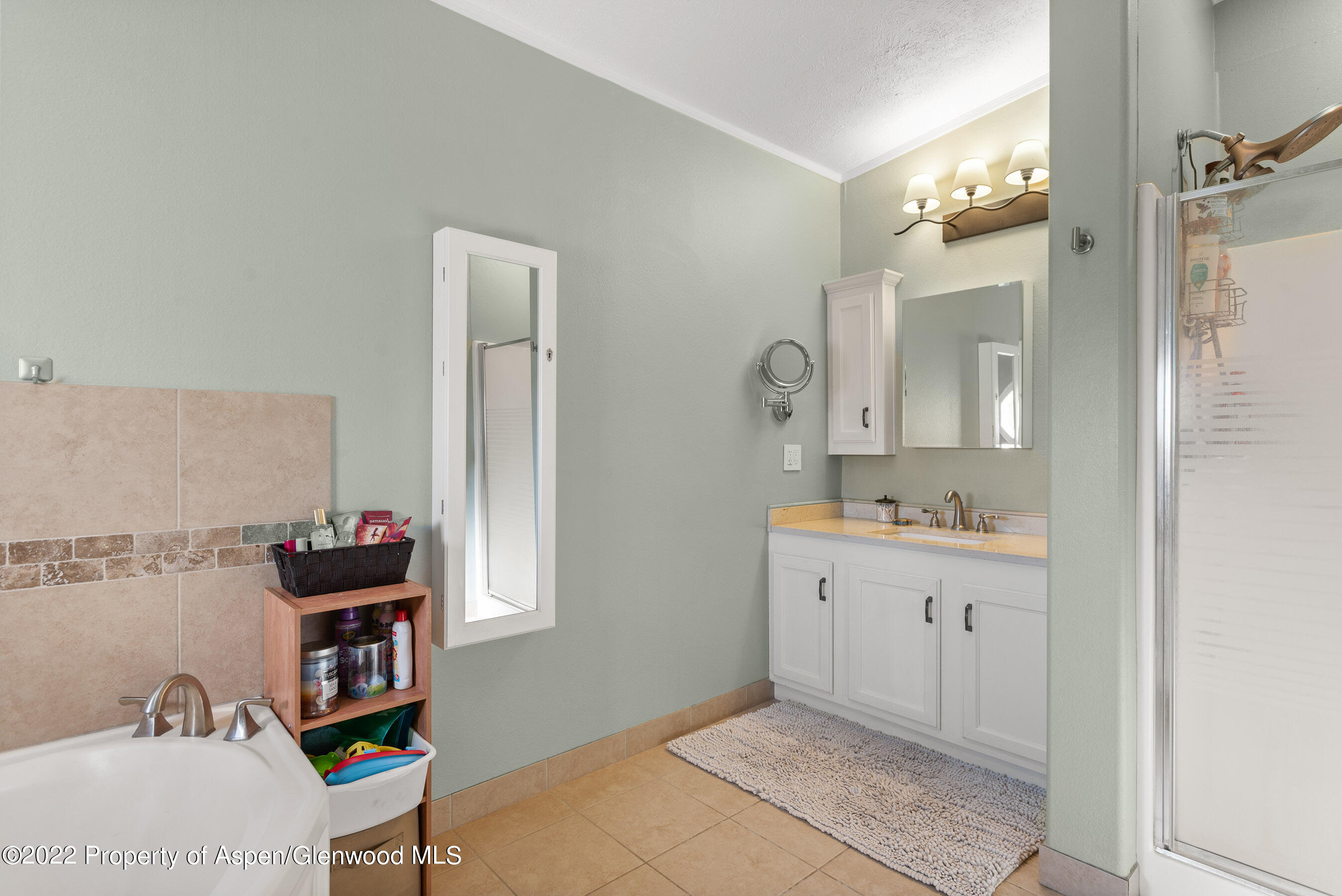 130 Swiss Lane Road Rifle, CO 81650 - Photo 13 of 39 a spacious bathroom with a mirror and a sink