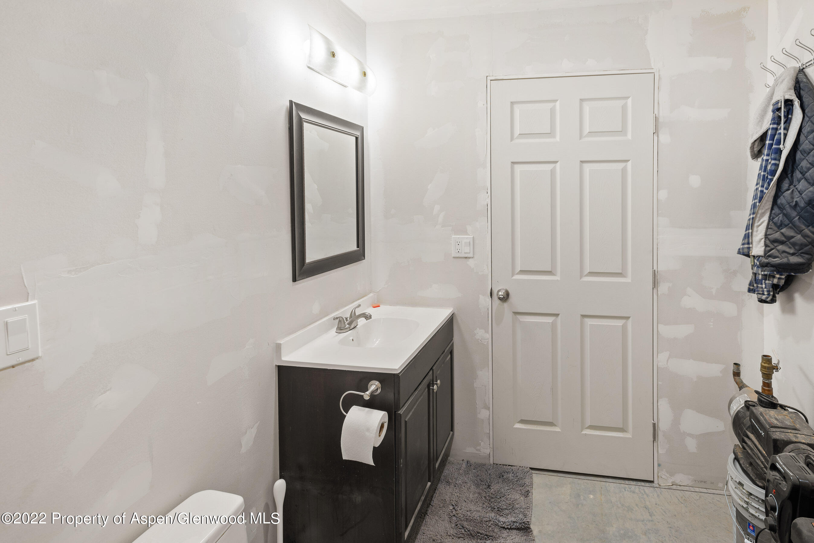 130 Swiss Lane Road Rifle, CO 81650 - Photo 23 of 39 a bathroom with a sink a mirror and vanity