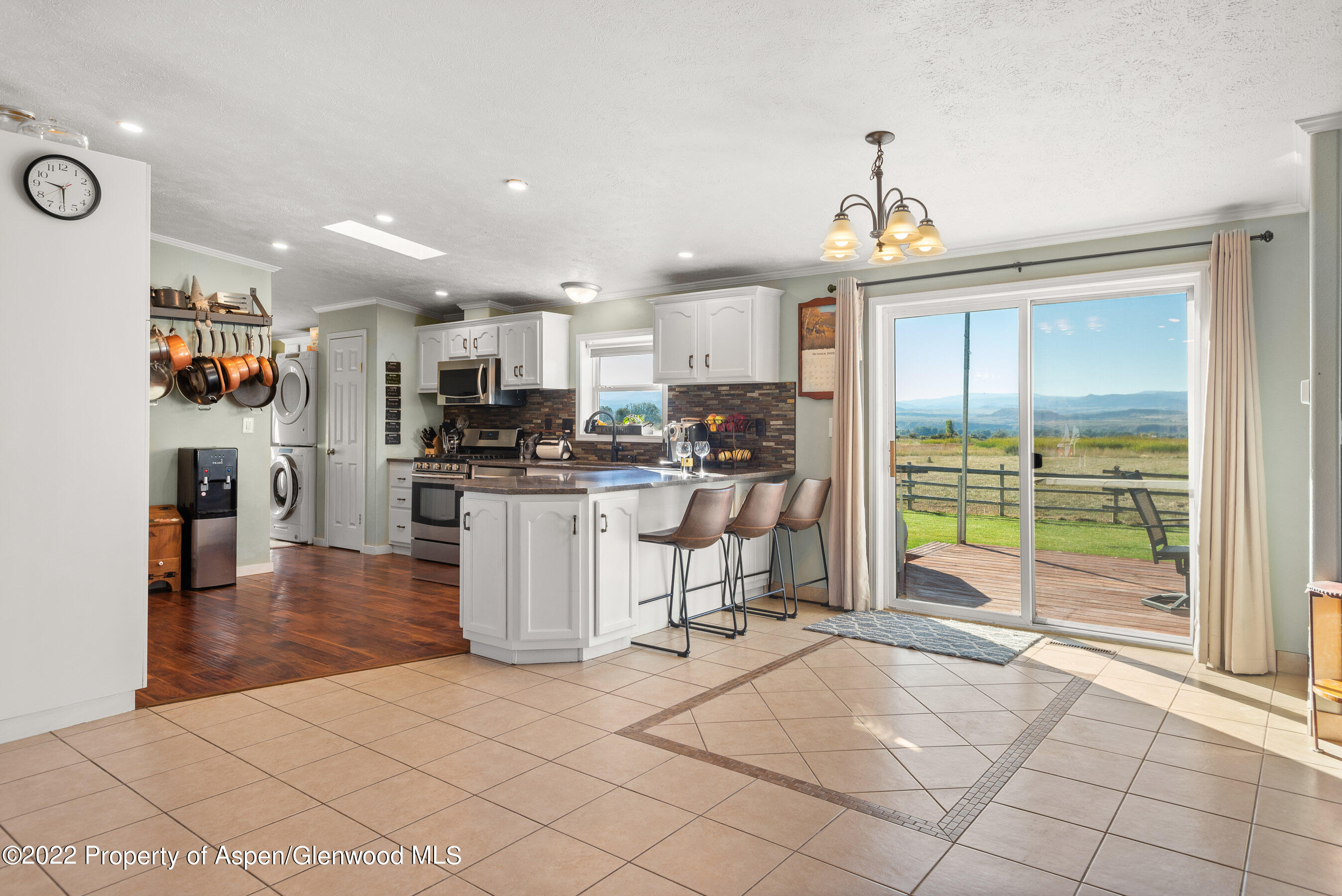 130 Swiss Lane Road Rifle, CO 81650 - Photo 5 of 39 a view of a kitchen with kitchen island stainless steel appliances refrigerator sink and cabinets