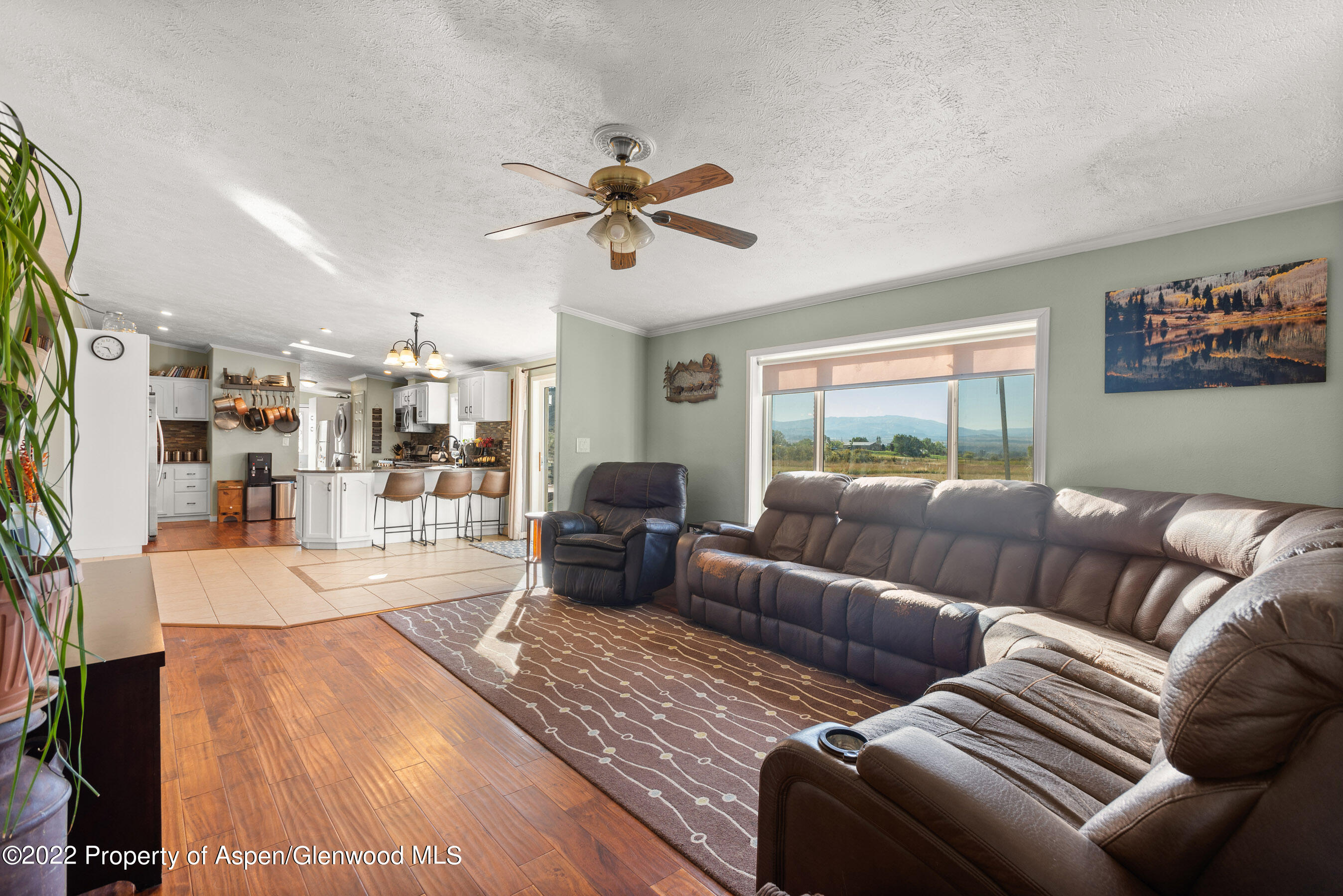 130 Swiss Lane Road Rifle, CO 81650 - Photo 8 of 39 a living room with furniture and a large window
