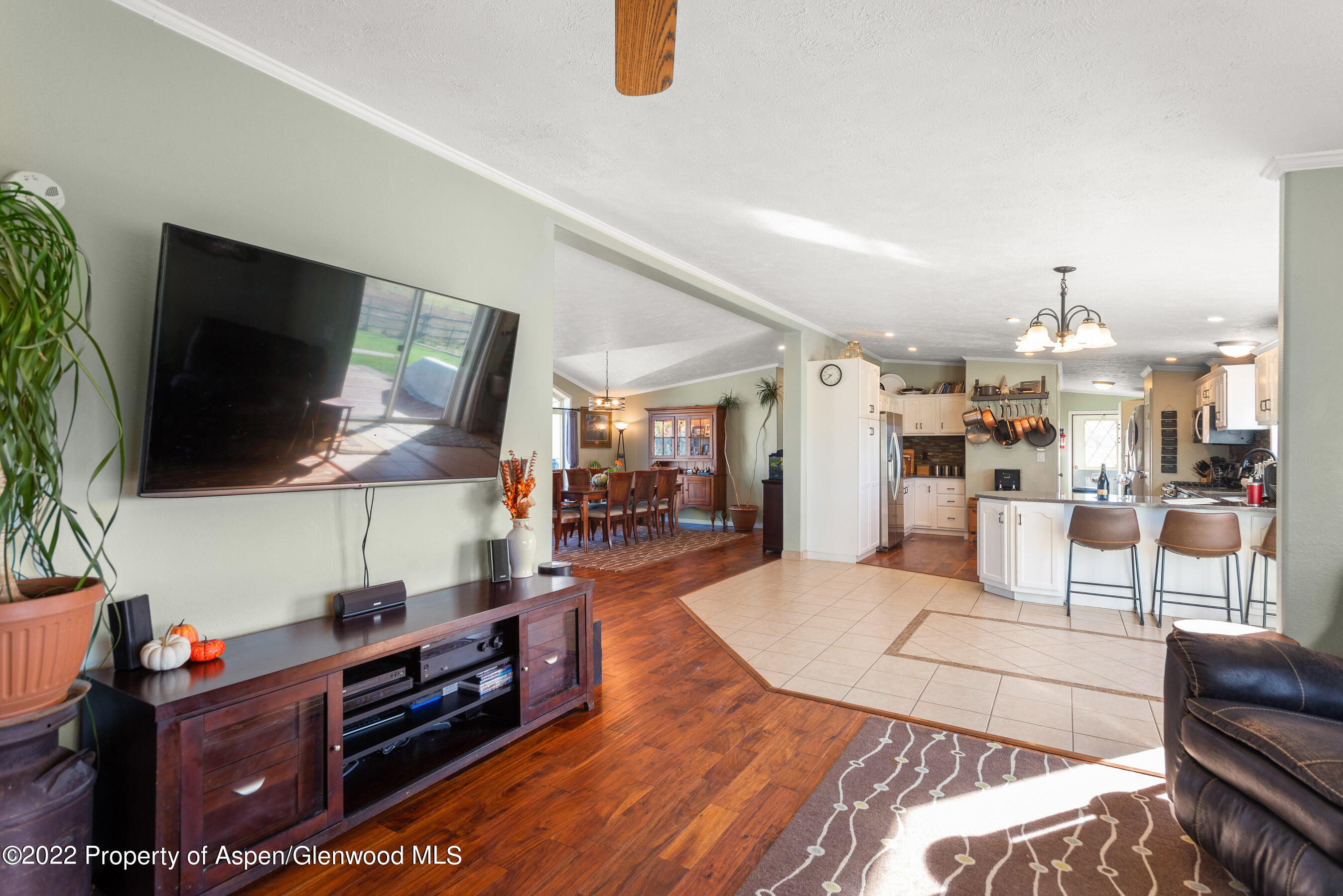 130 Swiss Lane Road Rifle, CO 81650 - Photo 10 of 39 a living room with furniture and a flat screen tv