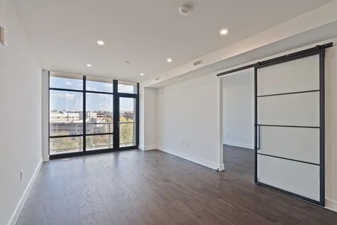 an empty room with large window
