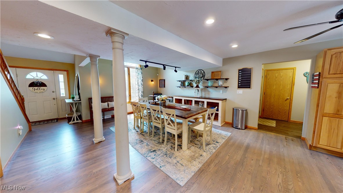 571 Ledge Road Macedonia, OH 44056 - Photo 4 of 35 Dining space featuring ornate columns, light hardwood / wood-style flooring, and rail lighting