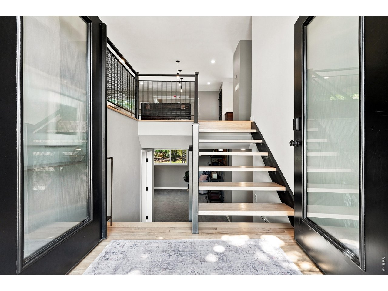 1964 Foothills Road Golden, CO 80401 - Photo 8 of 50 A custom wood-and-steel open staircase greets you at the door.