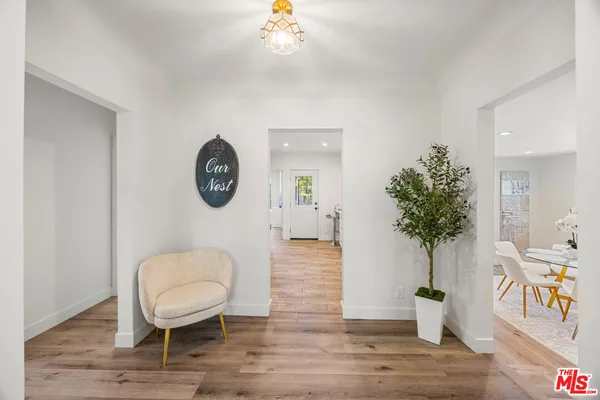 a room with furniture and wooden floor