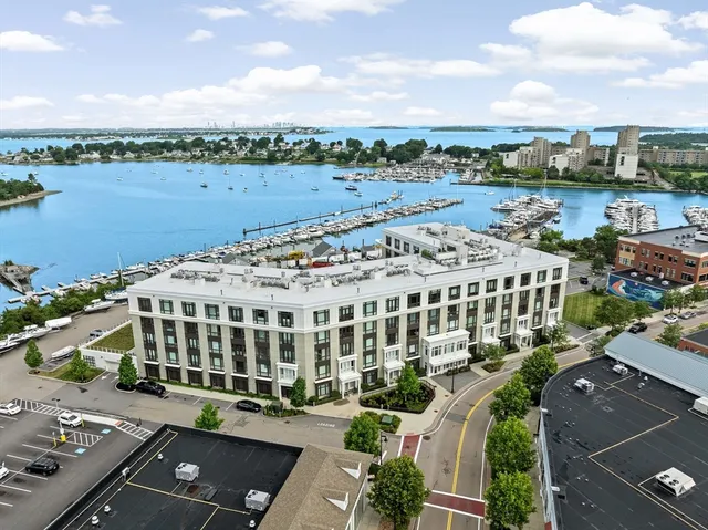 a view of a building with lake view and mountain view