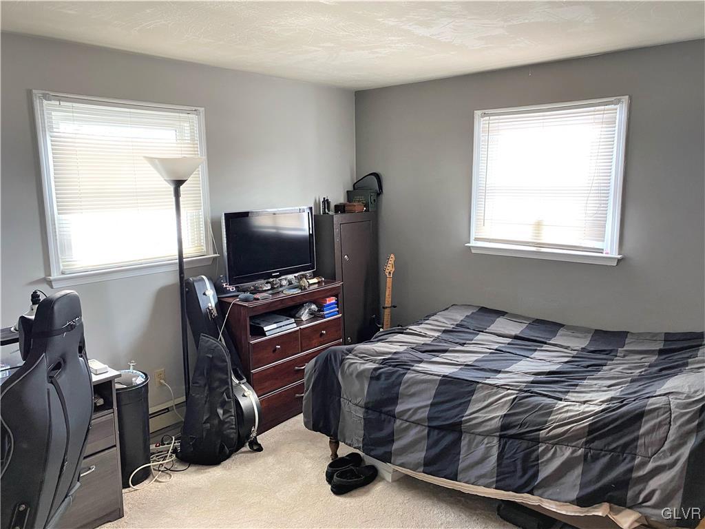 1415 Thomas Drive Coplay, PA 18037 - Photo 14 of 32 a bedroom with a bed and a flat screen tv