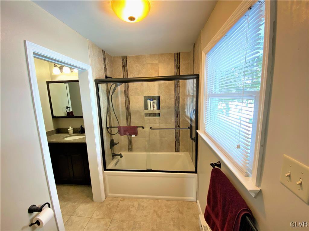 1415 Thomas Drive Coplay, PA 18037 - Photo 16 of 32 a view of walk in closet with clothes and shoes