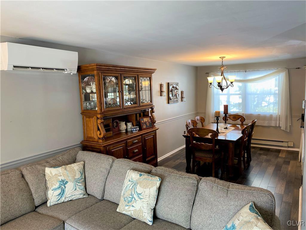 1415 Thomas Drive Coplay, PA 18037 - Photo 9 of 32 a living room with furniture and a dining table with kitchen view