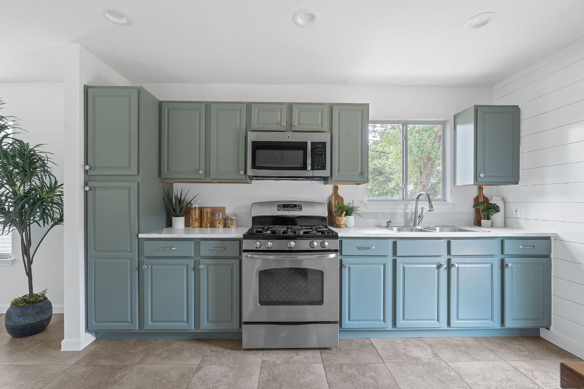 3404 Thomas Kincheon Street, Unit 1 & 3 Austin, TX 78745 - Photo 11 of 30 a kitchen with a stove and a sink