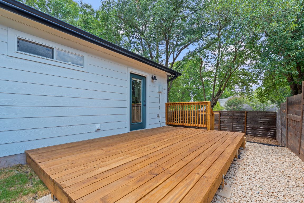 3404 Thomas Kincheon Street, Unit 1 & 3 Austin, TX 78745 - Photo 20 of 30 a view of a backyard with a wooden fence