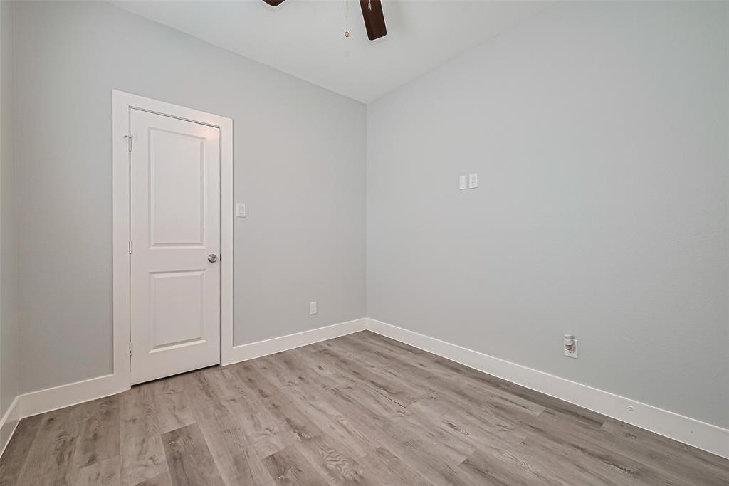 7926 Easter Street Houston, TX 77088 - Photo 16 of 24 a view of an empty room with wooden floor