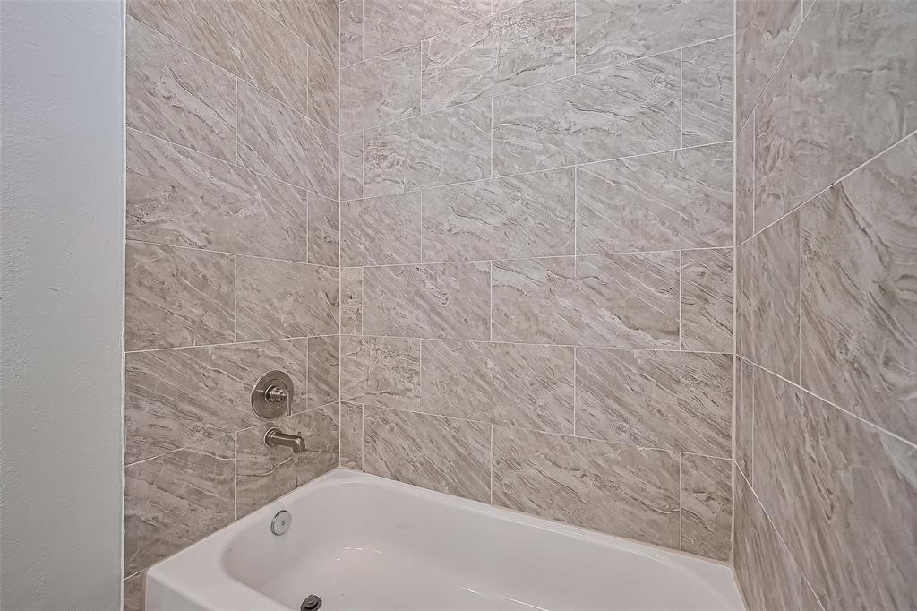 7926 Easter Street Houston, TX 77088 - Photo 21 of 24 a bathroom with a bathtub